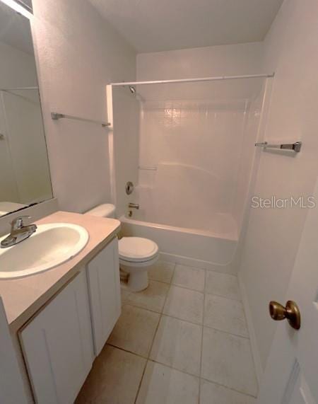 full bathroom featuring tile patterned flooring, vanity, toilet, and tub / shower combination