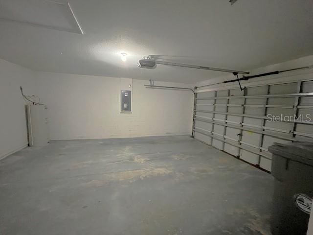 2712 NE 26th St, Ocala, FL 34470 - garage with electric panel and a garage door opener