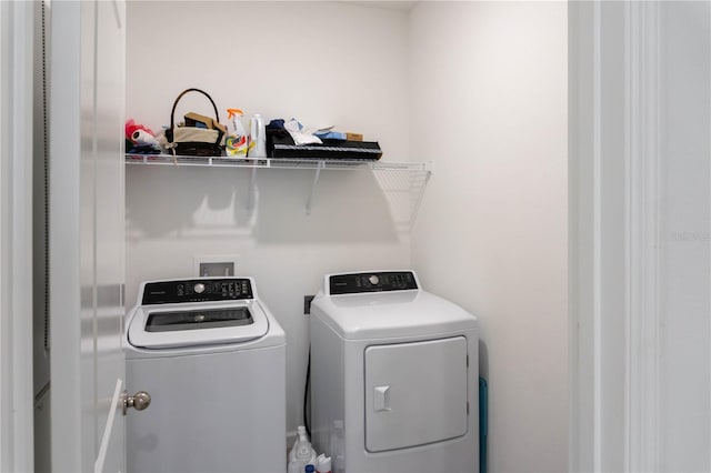 washroom with washing machine and dryer