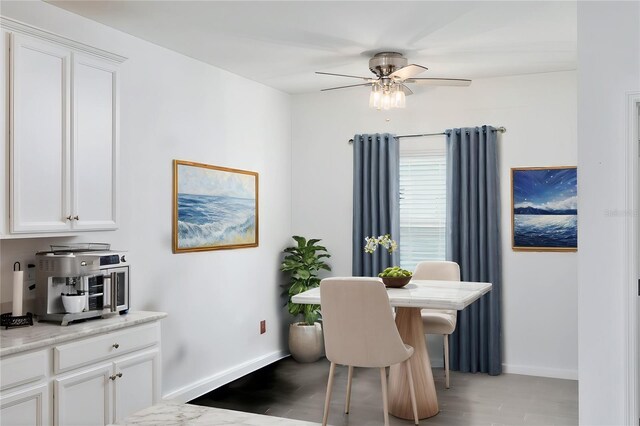 dining space featuring ceiling fan