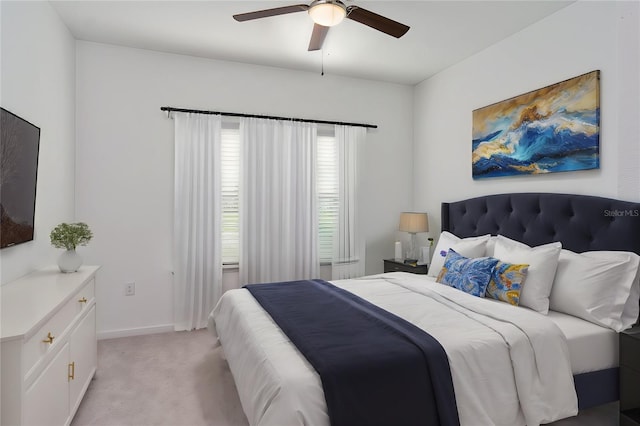 bedroom with light carpet and ceiling fan