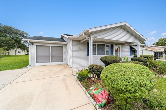 single story home featuring a garage and a porch