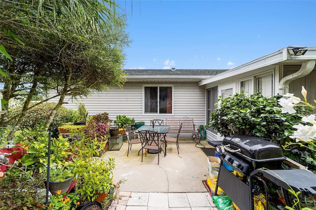 view of patio featuring a grill