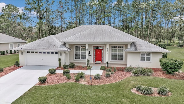 single story home featuring a garage and a front lawn