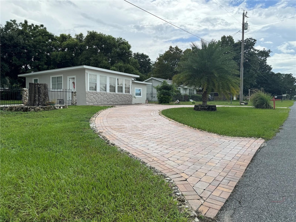 exterior space featuring a front lawn