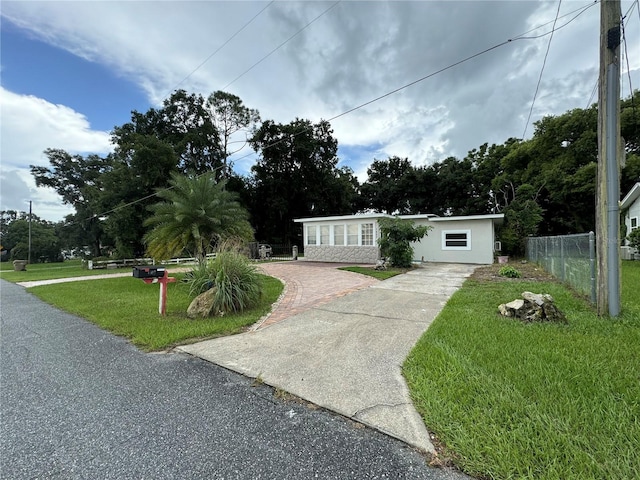 view of front of home with a front lawn