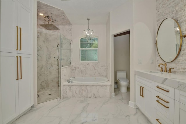 full bathroom featuring an inviting chandelier, shower with separate bathtub, vanity, and toilet