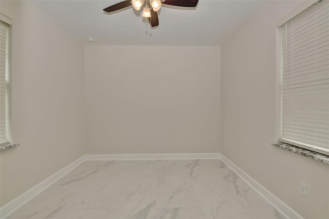 empty room featuring ceiling fan