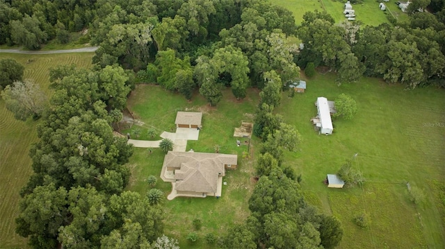 birds eye view of property with a rural view