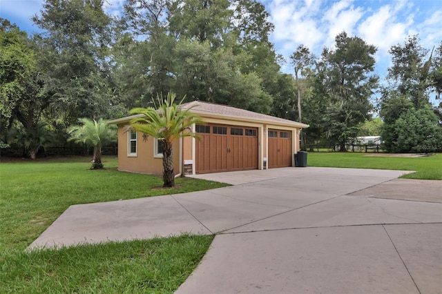 exterior space with a garage and a lawn