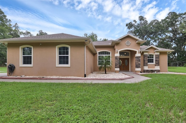 view of front of property with a front lawn