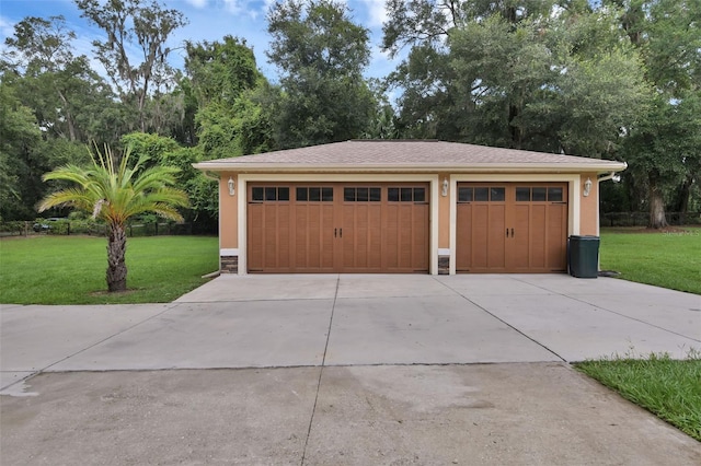 garage with a yard