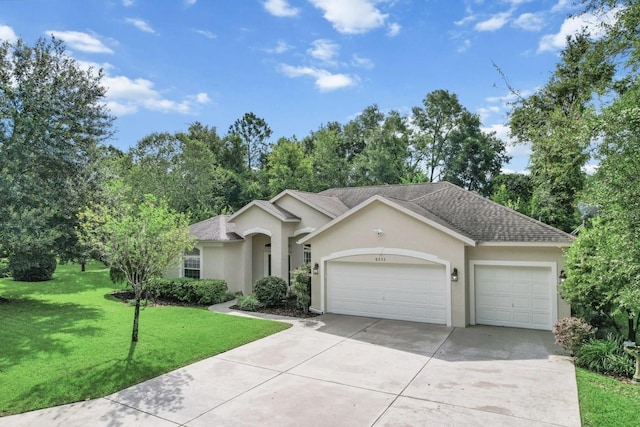 ranch-style home featuring a front yard and a garage