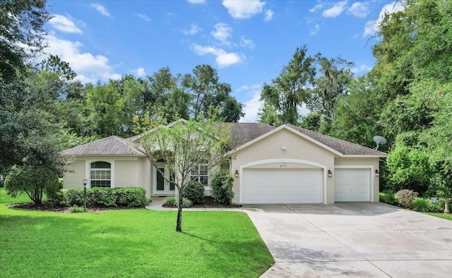 ranch-style home with a front lawn and a garage