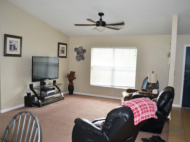 living room featuring carpet, ceiling fan, and lofted ceiling