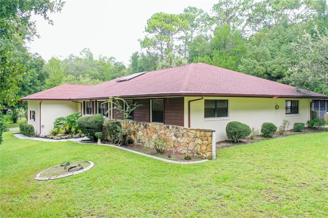 ranch-style home with a front yard