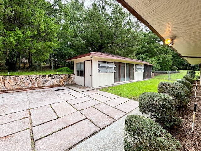 21389 SW 102nd Street Rd, Dunnellon, FL 34431 - view of patio / terrace with an outbuilding and fence