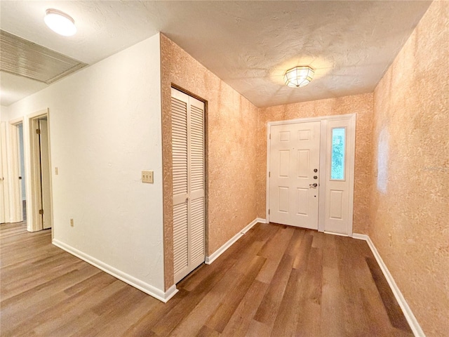 21389 SW 102nd Street Rd, Dunnellon, FL 34431 - entryway featuring a textured ceiling, baseboards, and wood finished floors