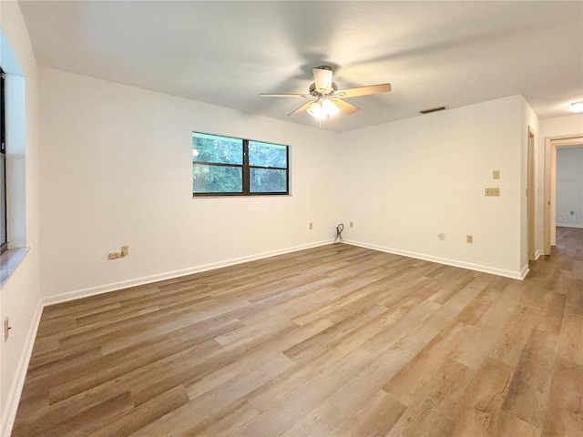 unfurnished room featuring ceiling fan and light hardwood / wood-style floors