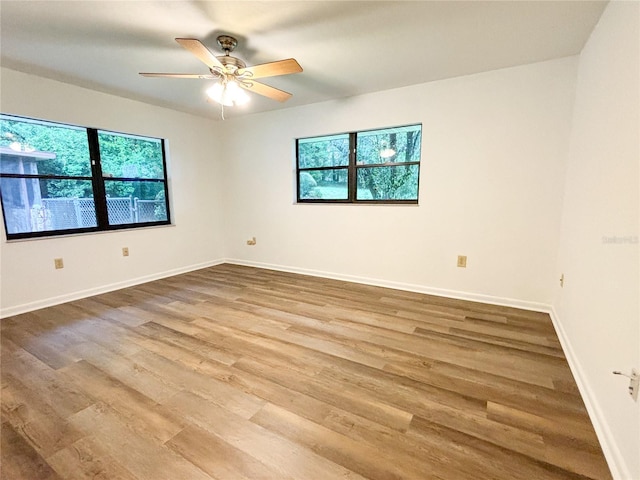 unfurnished room featuring ceiling fan and wood-type flooring