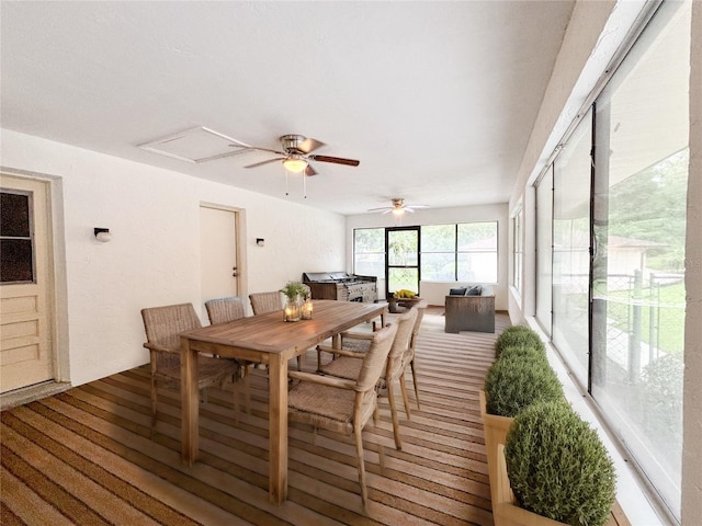 dining space with ceiling fan and hardwood / wood-style floors