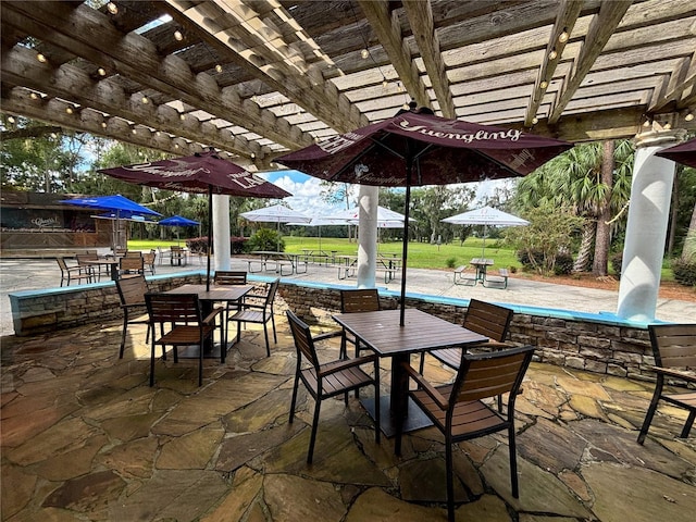 21389 SW 102nd Street Rd, Dunnellon, FL 34431 - view of patio / terrace featuring outdoor dining space and a pergola
