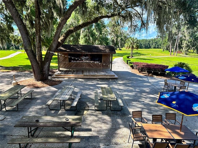 21389 SW 102nd Street Rd, Dunnellon, FL 34431 - view of home's community featuring a yard and a patio area