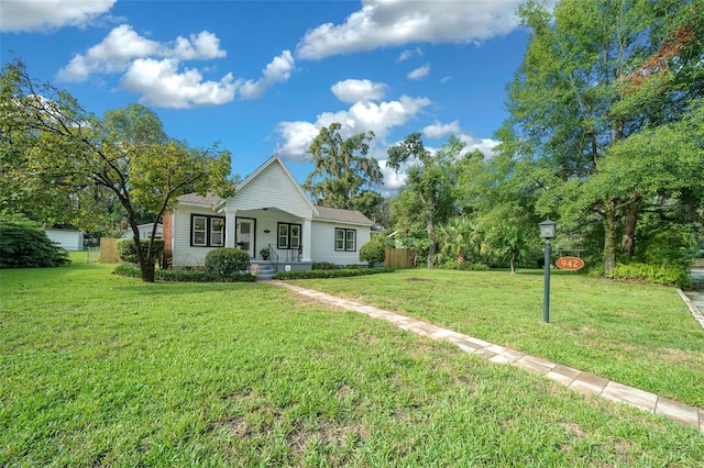 view of front facade with a porch and a front lawn