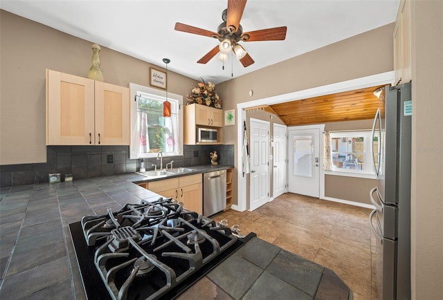 kitchen with ceiling fan, light brown cabinets, sink, black appliances, and tile counters