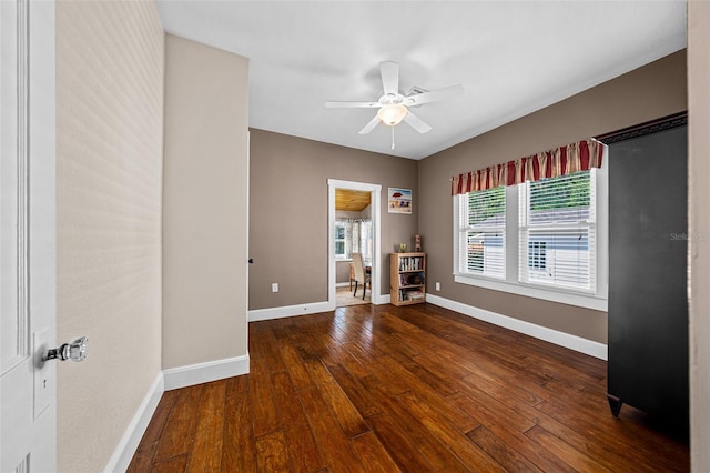 spare room with ceiling fan and hardwood / wood-style flooring