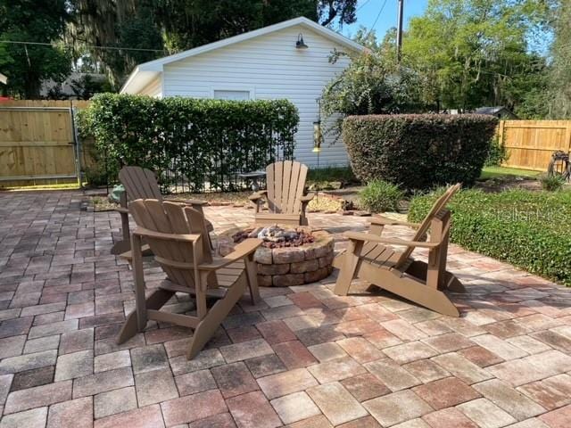 view of patio / terrace featuring an outdoor fire pit