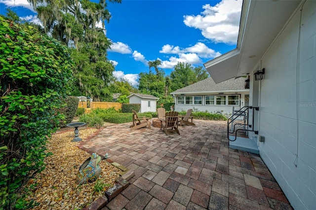 view of patio / terrace featuring a storage shed