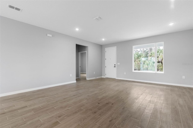 unfurnished room with light hardwood / wood-style flooring