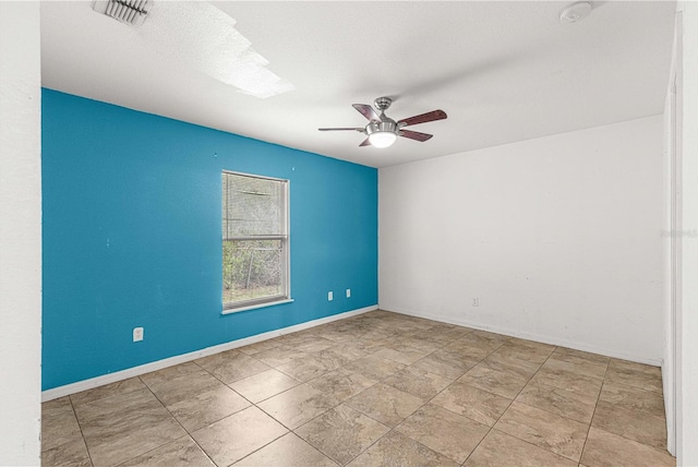 unfurnished room with ceiling fan