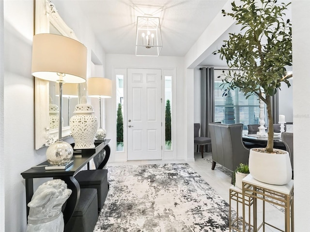 entryway featuring an inviting chandelier