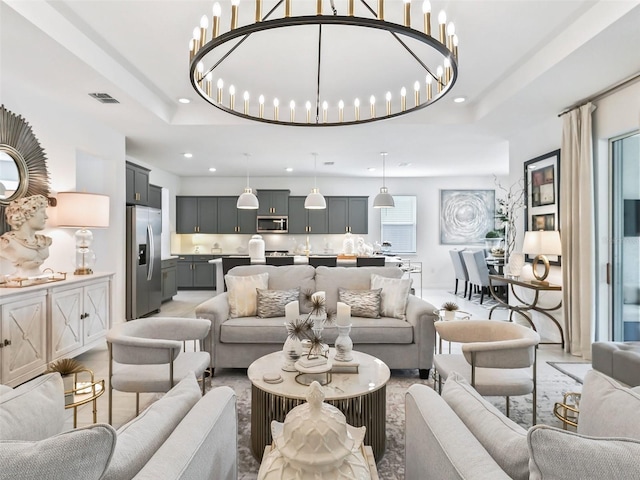 living room featuring a notable chandelier