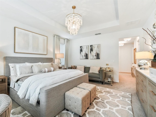 bedroom with light carpet and a chandelier