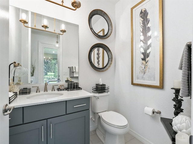 bathroom featuring vanity, toilet, and tile patterned floors