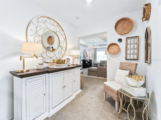 interior space featuring carpet flooring and a notable chandelier