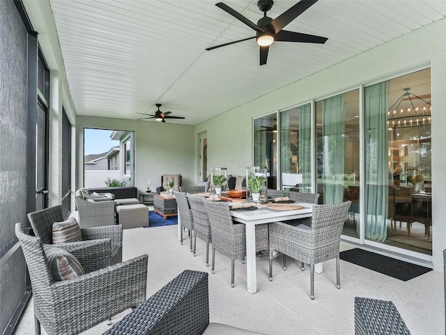 sunroom / solarium featuring ceiling fan