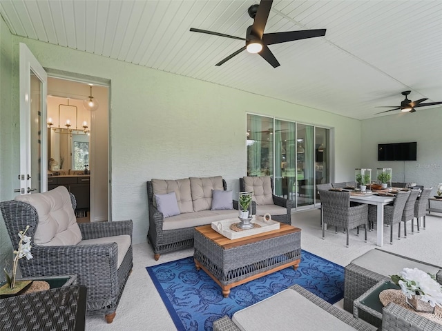 view of patio with an outdoor living space and ceiling fan