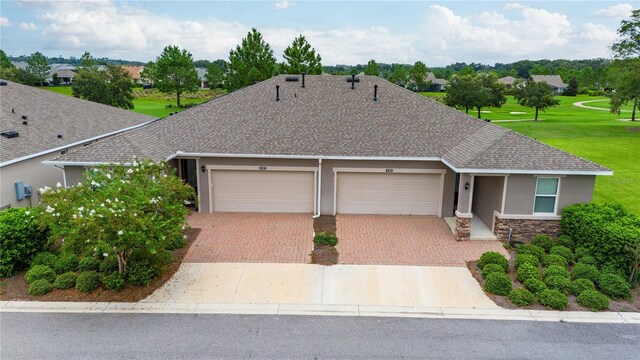 single story home with a garage