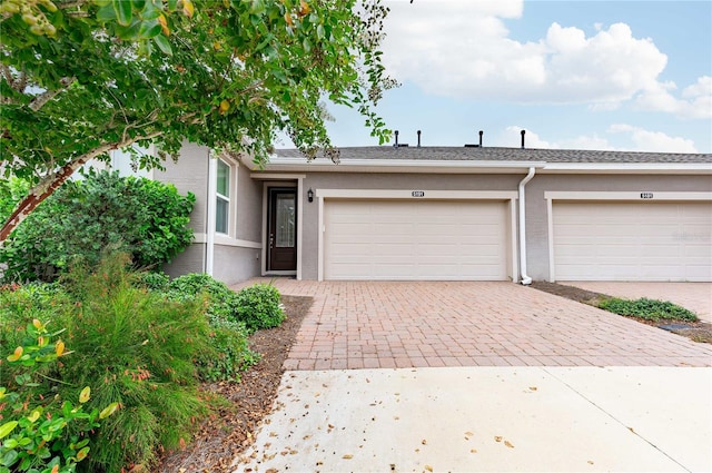 single story home with a garage