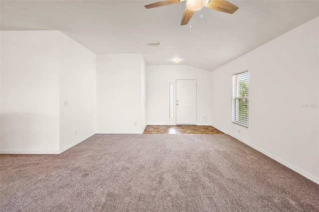 carpeted empty room with lofted ceiling and ceiling fan