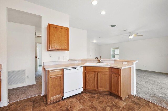 kitchen featuring white dishwasher, sink, kitchen peninsula, ceiling fan, and dark colored carpet