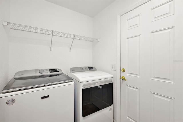 laundry area with separate washer and dryer