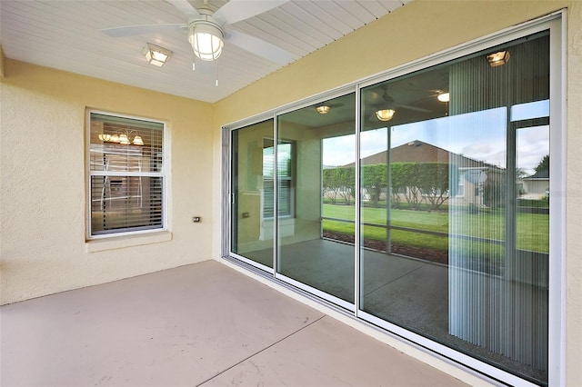 view of patio / terrace featuring ceiling fan and a mountain view