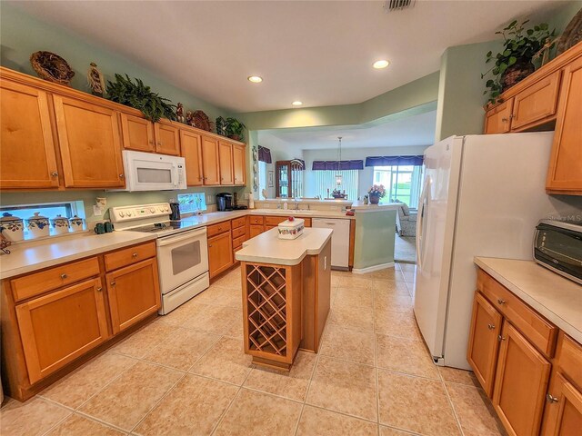 kitchen with white appliances, light tile patterned floors, kitchen peninsula, a center island, and sink