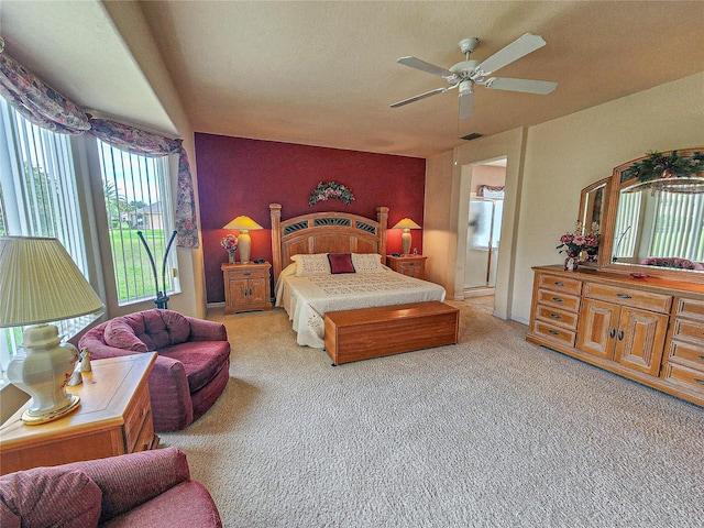 bedroom featuring light colored carpet and ceiling fan