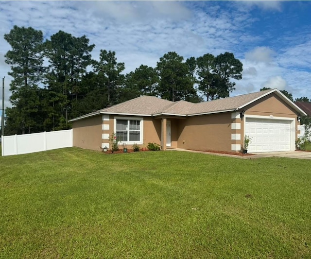 view of front facade with a garage and a front lawn